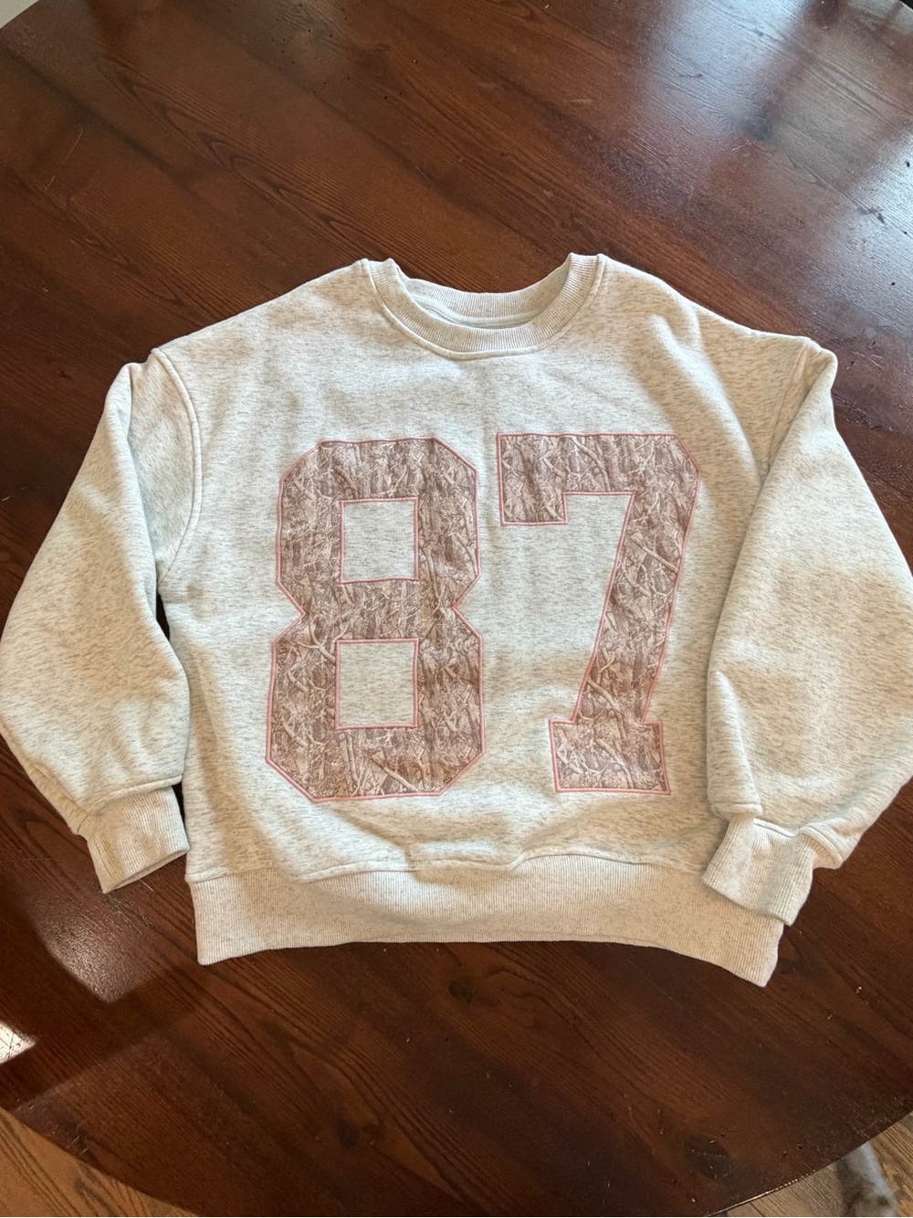 Light Gray Crewneck Sweater with Pink-Outlined '87' Graphic